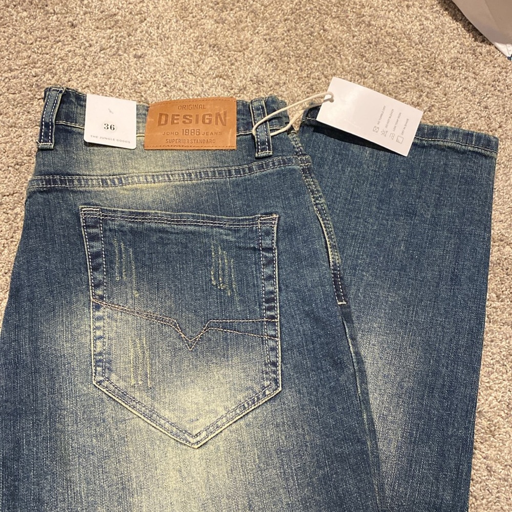 Brand new with tags, the jungle goods, clothing, distressed, dark denim jeans 36 - Picture 3 of 3